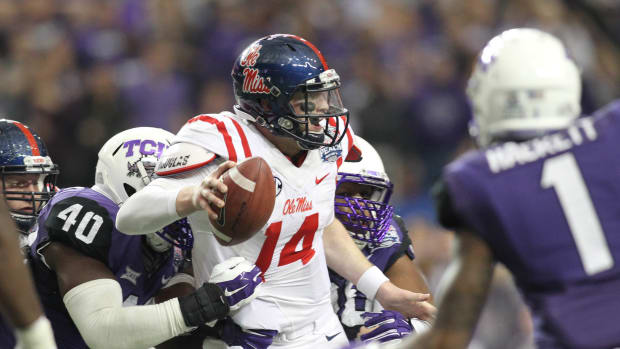 Dec 31, 2014; Atlanta , GA, USA; TCU Horned Frogs defensive end James McFarland (40) sacks Mississippi Rebels quarterback Bo Wallace (14) in the third quarter in the 2014 Peach Bowl at the Georgia Dome. Mandatory Credit: Brett Davis-USA TODAY Sports